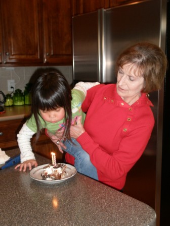 Kasen blowing out the candles for Nan